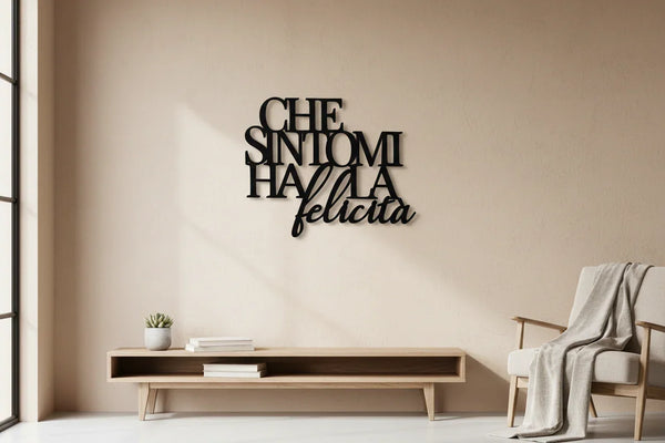 Modern minimalist living room with black wooden wall quote Che Sintomi Ha La Felicità above low wooden bench and armchair