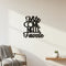 Black wooden wall decoration with Italian phrase, minimalist living room with armchair and small plant