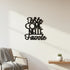Black wooden wall decoration with Italian phrase, minimalist living room with armchair and small plant