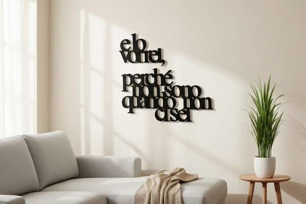 Modern living room with beige sofa, wooden side table with potted plant, and black wooden wall art quote in Italian