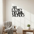 Black wooden wall art with Italian phrase 'Sei la più bella del mondo' in minimalist living room with armchair and plant