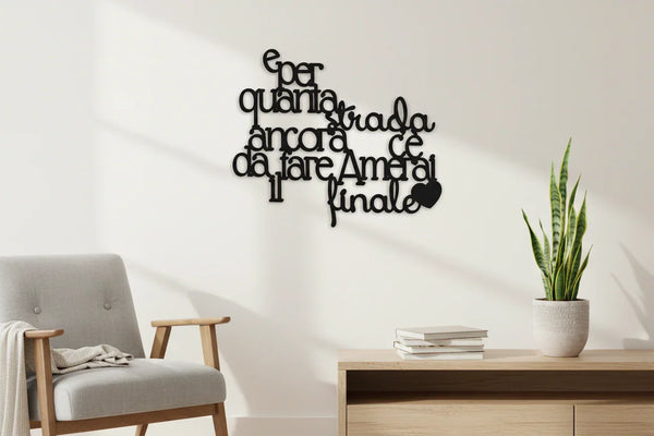 Modern home decor with black wooden wall quote in Italian above a wooden sideboard and gray armchair