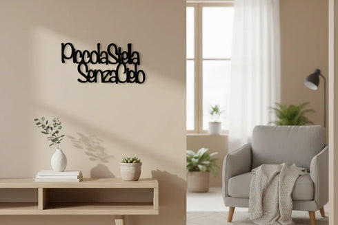 Modern living room with wooden wall decor phrase Piccola Stella Senza Cielo, gray armchair, plants, and neutral tones