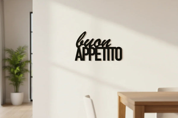 Modern kitchen wall decor with black wooden 'buon appetito' sign, dining table, and potted plant