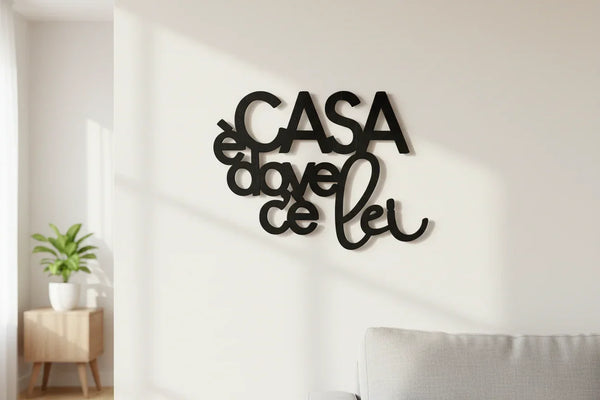 Black wooden wall decoration with Italian phrase 'Casa è dove c'è lei' in modern living room