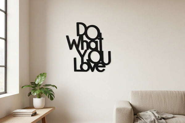 Modern home decor wooden wall art with phrase Do What You Love in black, beige sofa, and green potted plant