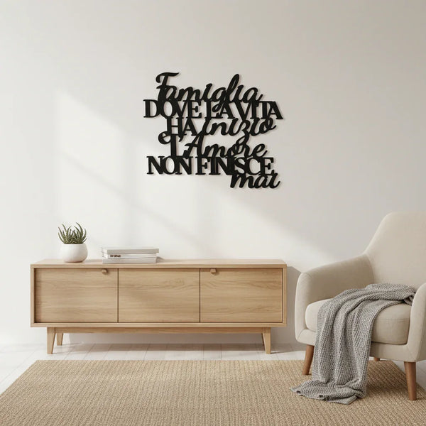 Minimalist living room with wooden cabinet, armchair, gray throw, and black Italian family quote wall decor
