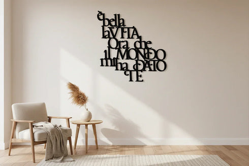 Minimalist living room with wooden armchair, side table, pampas grass vase, and black Italian wall decor