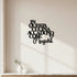 Black wooden kitchen wall decor saying in Italian "In questa cucina accadono cose magiche" on white wall with small vases on countertop