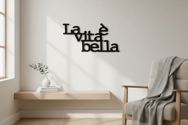 modern minimalist living room with wooden wall decoration 'La vita è bella', floating shelf with vase, and armchair with gray throw