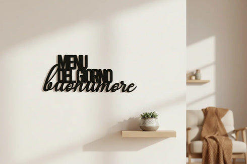 Black wooden wall decor with Italian text 'MENU DEL GIORNO buonumore' above a small shelf with a plant in cozy home setting