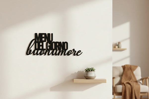 Black wooden wall decor with Italian text 'MENU DEL GIORNO buonumore' above a small shelf with a plant in cozy home setting