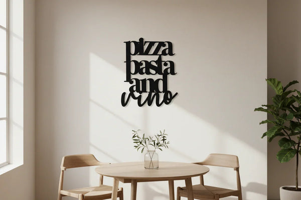 Modern dining area with wooden table and chairs, wall decoration reading pizza pasta and vino, bright natural light