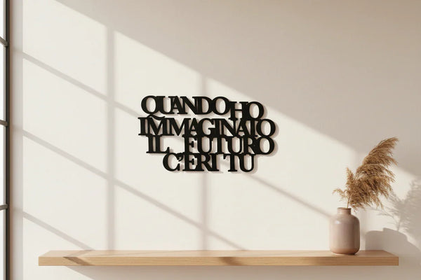 Wooden wall decoration with Italian phrase mounted on white wall, modern home decor with vase and dried pampas