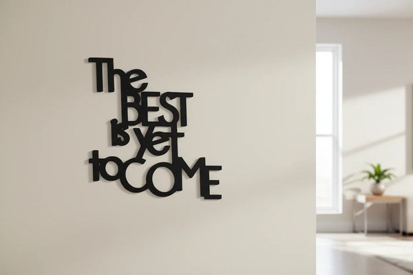 Black wooden wall decoration with inspirational quote The Best Is Yet To Come in modern living room