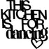 Decorative black wooden wall sign with text This kitchen is for dancing and a heart shape