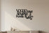 Black wooden wall decoration with Italian phrase in modern living room, minimalist home decor