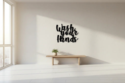 Minimalist room with light wooden bench, small potted plant, and black 'Wash Your Hands' wall decor