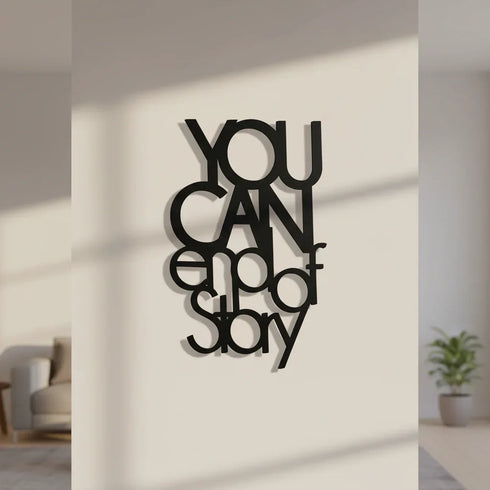 Black wooden wall decor with inspirational quote "YOU CAN end of story" in modern home setting