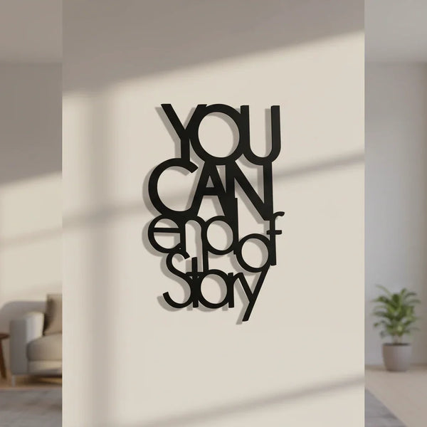 Black wooden wall decor with inspirational quote "YOU CAN end of story" in modern home setting