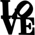 Black wooden home decoration spelling the word LOVE with tilted O letter